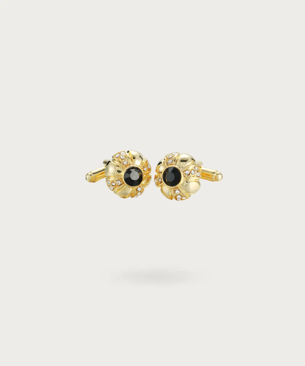 Boutons de manchette en forme de bouton avec une finition dorée lumineuse et un contraste noir profond, symbolisant l'élégance et le luxe.