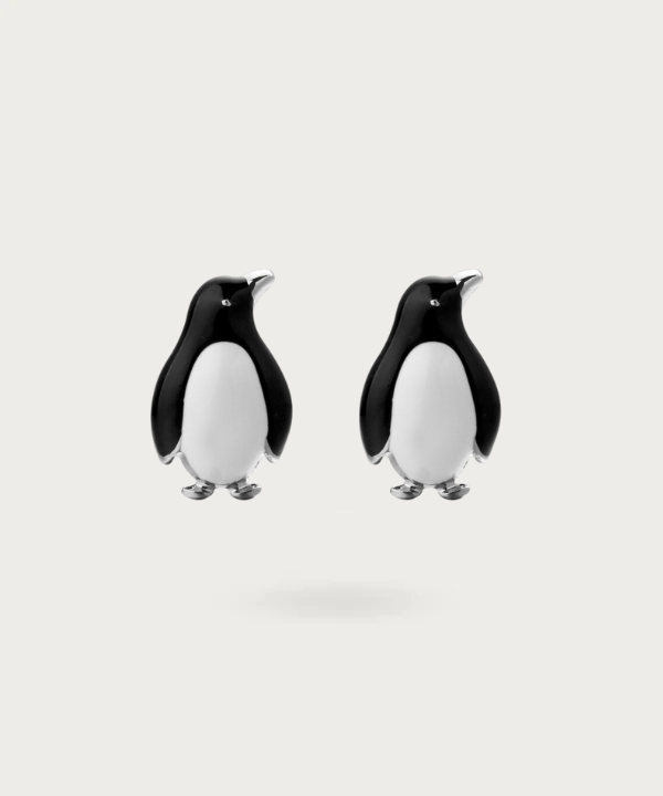 Boutons de manchette délicatement conçus en forme de pingouins, apportant une touche d'humour sophistiqué à votre style. noir et blanc
