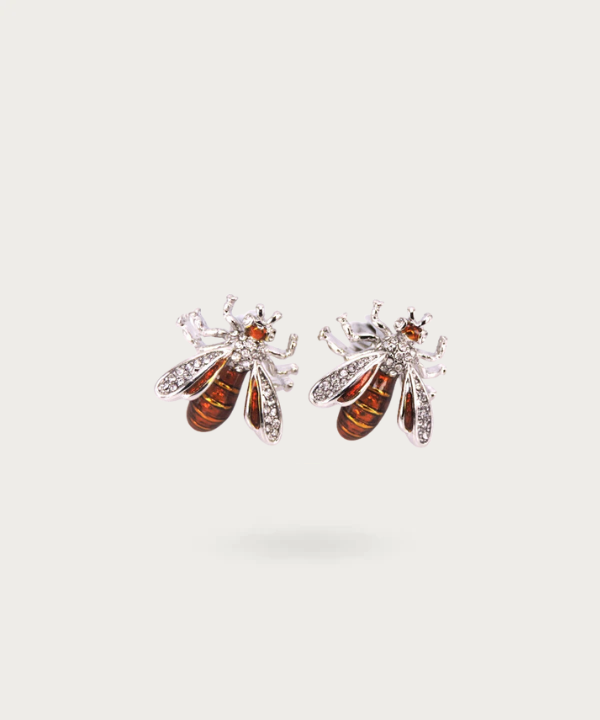 Boutons de manchette finement conçus en forme d'abeille, représentant la diligence et la beauté naturelle.