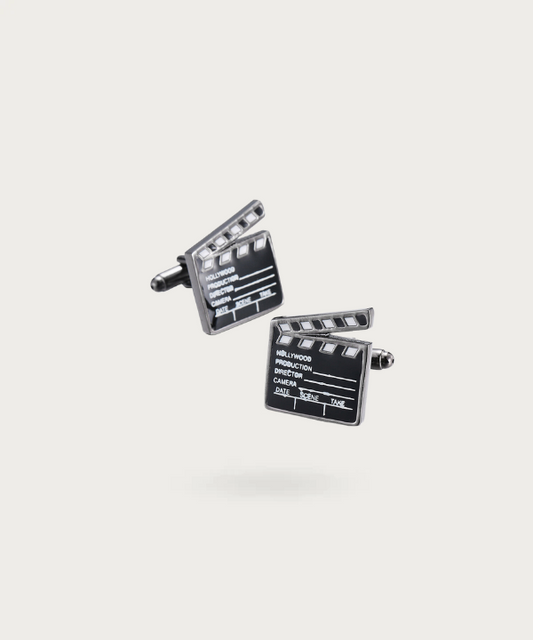 "Bouton de manchette représentant le clapet de cinéma"