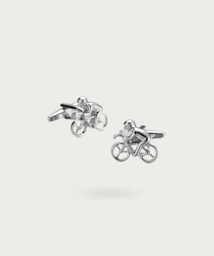 Boutons de manchette 'Tour De France' en argent, représentant un vélo de course avec un cycliste, symbolisant la vitesse, l'endurance et l'élégance.