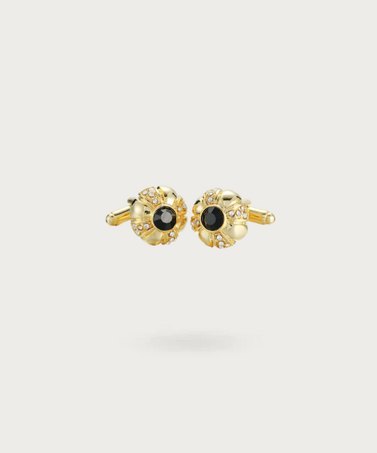 Boutons de manchette en forme de bouton avec une finition dorée lumineuse et un contraste noir profond, symbolisant l'élégance et le luxe.