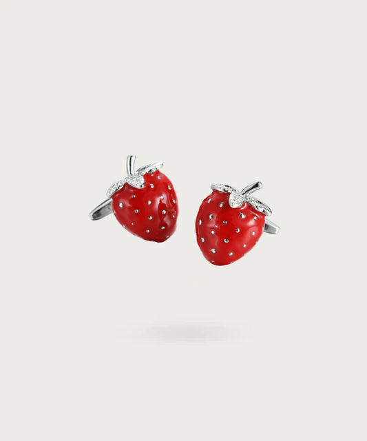 Boutons de manchette en forme de fraise rouge, détaillés et colorés, reflétant l'élégance et l'audace du porteur.