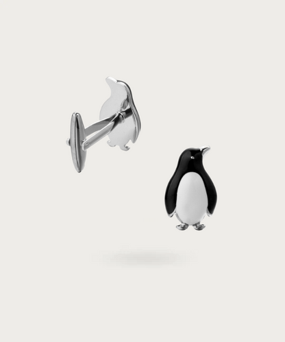 Boutons de manchette délicatement conçus en forme de pingouins, apportant une touche d'humour sophistiqué à votre style.