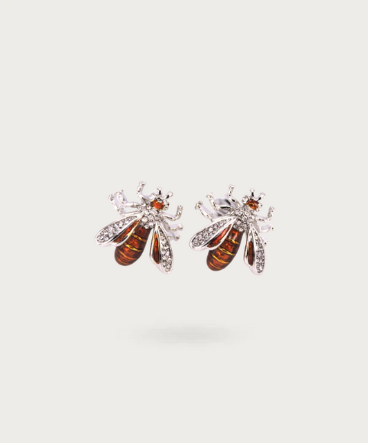 Boutons de manchette finement conçus en forme d'abeille, représentant la diligence et la beauté naturelle.