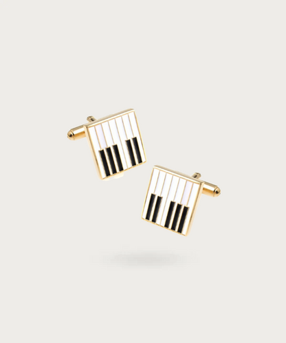 "Bouton de manchette représentant des touches de piano"
