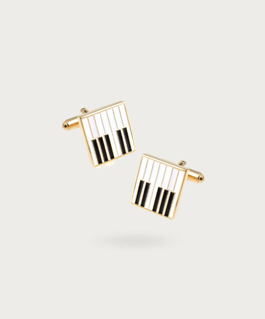 "Bouton de manchette représentant des touches de piano"